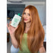 Woman holding Gold Spell Co. Liso Etico Frizz Reduction Hair Mask for Smoothness - Buy now at MKPBR.COM - Worldwide Shipping