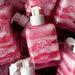 Hotflowers Blow Girl Intimate Aromatic Gel Strawberry & Cream 320ml – A close-up view of multiple bottles, showcasing the appealing pink and white swirled texture of the intimate gel for enhanced visibility – Buy now at MKPBR.COM – Worldwide Shipping.