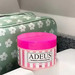 Adeus Cream cellulite and stretch mark cream in pink striped jar for intensive skin treatment