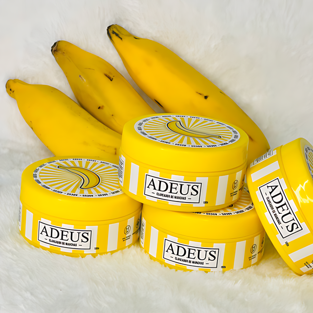 Adeus Dark Spot Correcting Cream for Intimate Areas and Body – 3.52 oz (100g). Product tube displayed with fresh bananas, highlighting natural banana extract for brightening – Buy now at MKPBR.COM – Worldwide Shipping