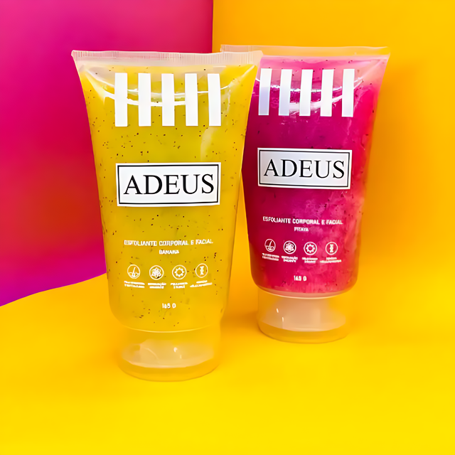 The Adeus Duo Exfoliator Kit with yellow banana and pink pitaya skin renewal and brightening scrubs, standing upright against a vibrant, modern split orange and pink background– Buy now at MKPBR.COM – Worldwide Shipping
