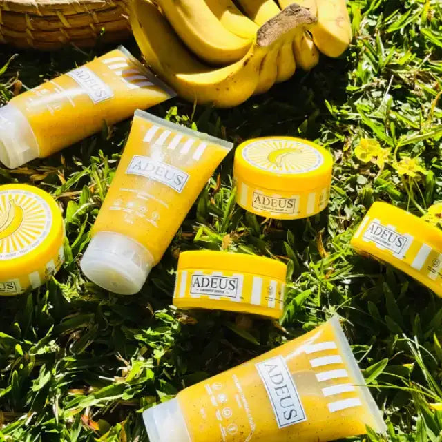 Adeus Mega Transformation Kit – Complete Skin Renewal, Brightening & Firming Set. All four products (Dark Spot Cream, Banana Exfoliator, Cellulite Cream, Pitaya Exfoliator) displayed in a serene natural setting – Buy now at MKPBR.COM – Worldwide Shipping