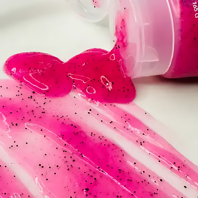 Adeus Pitaya Skin Renewal Exfoliator – Smoothing Body & Face Scrub, 5.82 oz (165g) - Open tube cap and product swatches smeared on a surface, highlighting the scrub's texture – Buy now at MKPBR.COM – Worldwide Shipping