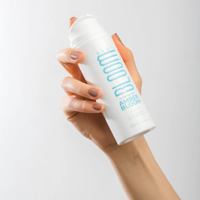 Amber Bloom Self Tanning Body Milk, Sunless Gradual Tanner + Deep Hydration – 4.06 fl oz (120 ml) close-up of Amber Bloom branding – Buy now at MKPBR.COM – Worldwide Shipping