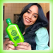 Smiling model with long hair holding Gold Spell Babosa & Azeite de Oliva hair care 250ml - Buy now at MKPBR.COM - Worldwide Shipping