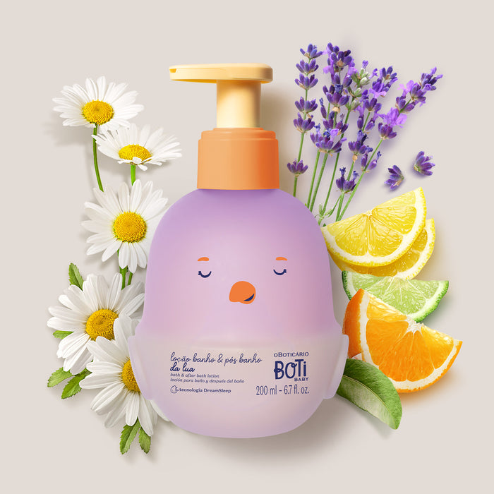 Boticário Boti Baby Lua Baby Lotion 200 ml bottle surrounded by chamomile flowers, lavender and citrus slices illustrating the soft evening fragrance – Buy now at MKPBR.COM – Worldwide Shipping