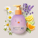 Boticário Boti Baby Lua Baby Lotion 200 ml bottle surrounded by chamomile flowers, lavender and citrus slices illustrating the soft evening fragrance – Buy now at MKPBR.COM – Worldwide Shipping