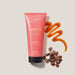O Boticário Coffee Woman Unique body lotion 200 ml tube in a flat lay with roasted coffee beans and a salted caramel swirl – Buy now at MKPBR.COM – Worldwide Shipping