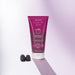 Boticário Cuide-se Bem Amoruda exfoliating body wash tube standing beside fresh blackberries on a soft lilac background – Buy now at MKPBR.COM – Worldwide Shipping