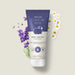 Boticário Cuide-se Bem Boa Noite 200 ml body lotion tube styled with fresh chamomile flowers and purple florals on a soft beige background – Buy now at MKPBR.COM – Worldwide Shipping