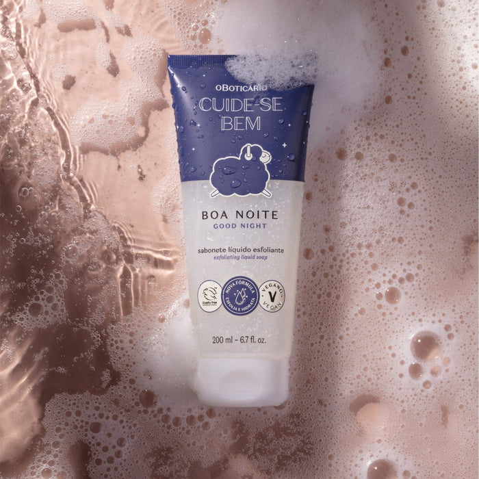 Boticário Boa Noite exfoliating body wash tube surrounded by creamy shower lather and water bubbles – Buy now at MKPBR.COM – Worldwide Shipping