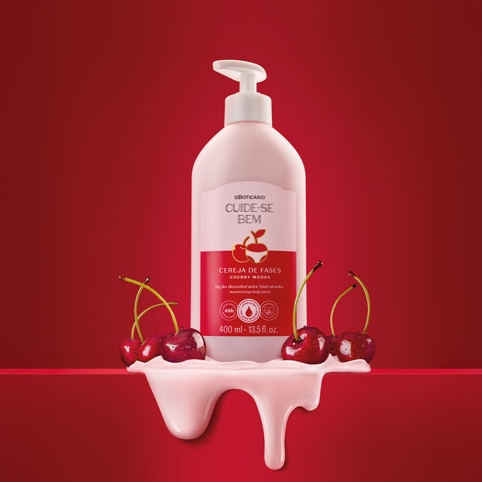 Boticário Cuide-se Bem Cereja de Fases body lotion bottle on a red background surrounded by glossy cherries and a creamy pink lotion pour – Buy now at MKPBR.COM – Worldwide Shipping