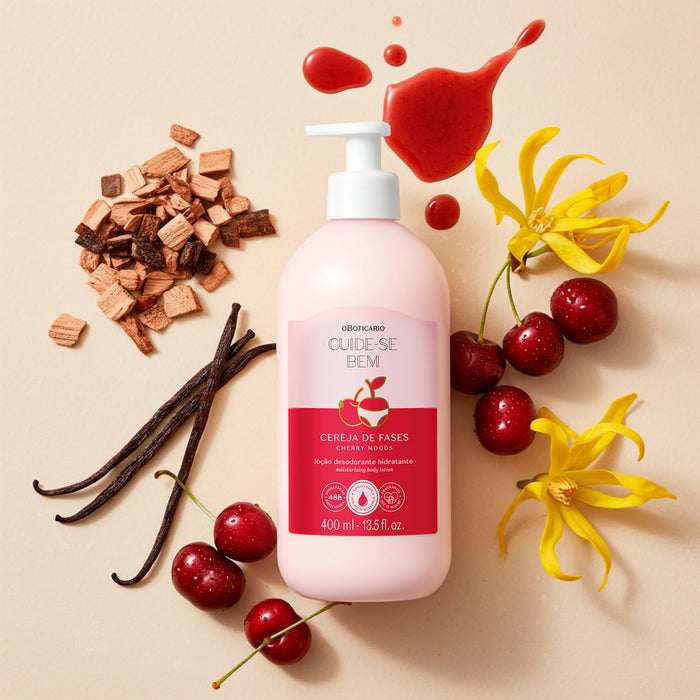 Boticário Cuide-se Bem Cereja de Fases body lotion bottle in a flat lay with cherries, vanilla pods, cedarwood chips, ylang-ylang flowers and a drop of cherry syrup – Buy now at MKPBR.COM – Worldwide Shipping