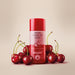Boticário Cuide-se Bem Cereja de Fases Warming Body Oil 110 ml bottle surrounded by fresh cherries, cherry floral gourmand scent – Buy now at MKPBR.COM – Worldwide Shipping