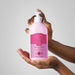 Creamy texture of Boticário Cuide-se Bem Cereja Livre deodorant body lotion swatched on a hand – Buy now at MKPBR.COM – Worldwide Shipping