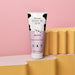 O Boticário Cuide-se Bem Deleite 200 ml deodorant body lotion tube photographed on a pink and yellow studio set, side view of the vegan formula packaging – Buy now at MKPBR.COM – Worldwide Shipping