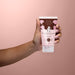 Boticário Cuide-se Bem Deleite Chocolatudo body scrub being massaged onto hands to show the gentle physical exfoliation – Buy now at MKPBR.COM – Worldwide Shipping