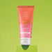 Boticário Cuide-se Bem Pessegura peach body lotion 200 ml tube standing upright on a lime green studio backdrop – Buy now at MKPBR.COM – Worldwide Shipping