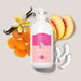 Boticário Cuide-se Bem Doçura na Pessegura body lotion 400 ml bottle styled with fresh peach slices, coconut pieces and vanilla pods showing the gourmand scent – Buy now at MKPBR.COM – Worldwide Shipping