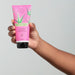 Creamy white texture of the O Boticário Cuide-se Bem Feira Aloe Vera Leave-In Styling Cream swatched on hands, showing the lightweight Brazilian aloe formula for shine – Buy now at MKPBR.COM – Worldwide Shipping