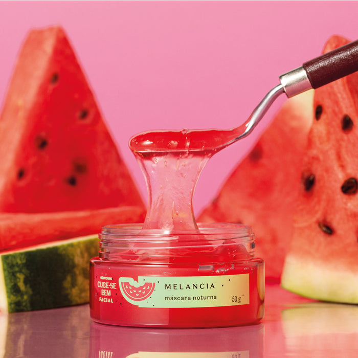 Open jar of Boticário Cuide-se Bem Melancia overnight face mask with pink watermelon gel lifted on a spatula beside fresh watermelon slices – Buy now at MKPBR.COM – Worldwide Shipping