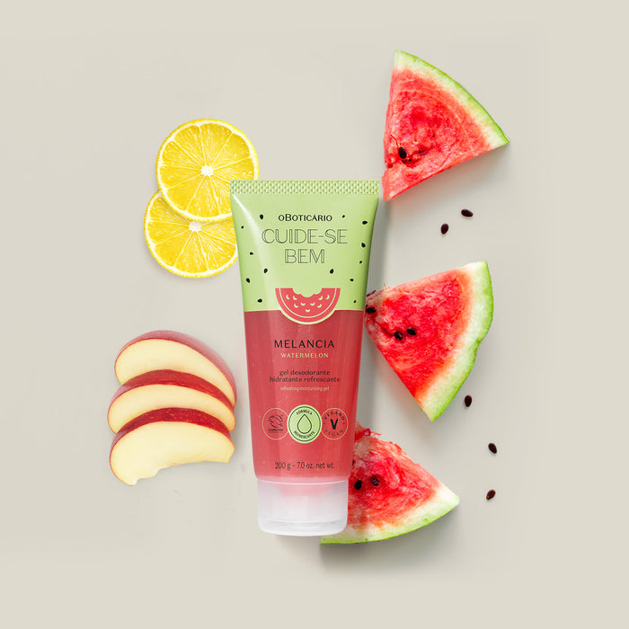 O Boticário Cuide-se Bem Melancia watermelon body gel tube styled flat lay with fresh watermelon wedges, lemon and apple slices – Buy now at MKPBR.COM – Worldwide Shipping
