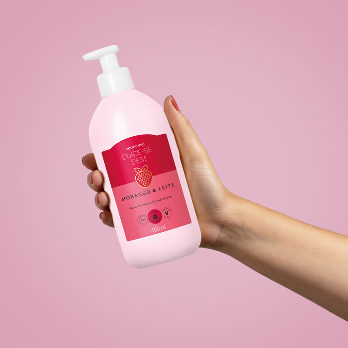 Close-up of the light pink fast-absorbing lotion texture of Boticário Cuide-se Bem Morango e Leite Brazilian deodorant body moisturizer – Buy now at MKPBR.COM – Worldwide Shipping