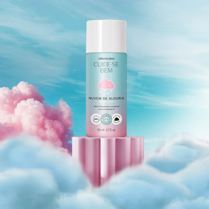Boticario Cuide-se Bem Nuvem de Alegria brazilian body oil bottle displayed on a pink pedestal among soft pastel clouds – Buy now at MKPBR.COM – Worldwide Shipping