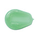 Swatch of the pearly green gel texture of Boticário Dr. Botica Poção da Espuma Kids Shampoo for Coils 4ABC on a white background – Buy now at MKPBR.COM – Worldwide Shipping