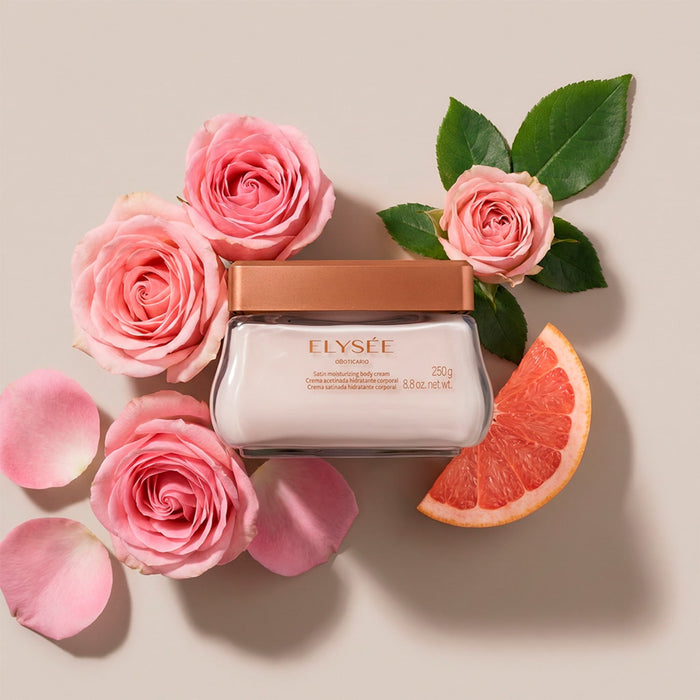 Flat lay of Boticário Elysée Satin Body Cream 250 g jar surrounded by pink roses and grapefruit illustrating the signature floral Elysée fragrance – Buy now at MKPBR.COM – Worldwide Shipping
