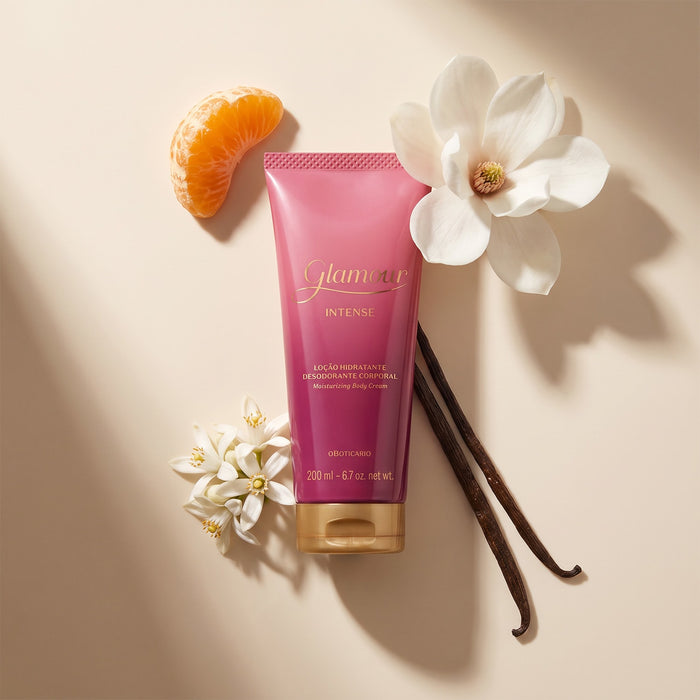 Boticário Glamour Intense Body Lotion flat lay with magnolia blossom, vanilla pods, orange segment and orange blossom on beige background – Buy now at MKPBR.COM – Worldwide Shipping