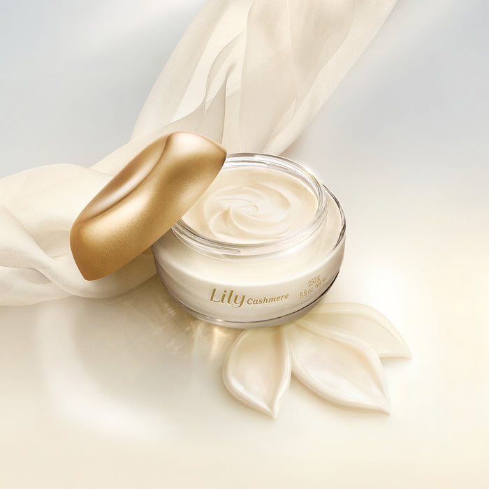 Open jar of Boticário Lily Cashmere Satin Body Cream showing the swirled velvety cream beside a cream silk scarf and golden lid – Buy now at MKPBR.COM – Worldwide Shipping