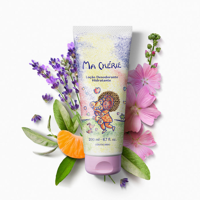 Boticário Ma Chérie Deodorant Body Lotion tube surrounded by lavender sprigs, a mandarin segment and pink mallow flowers illustrating the soft floral fragrance – Buy now at MKPBR.COM – Worldwide Shipping