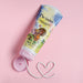 Open tube of Boticário Ma Chérie Deodorant Body Lotion with a heart drawn in white lotion on a pink background showing the creamy texture – Buy now at MKPBR.COM – Worldwide Shipping