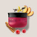 Nativa SPA Ameixa body cream-oil jar styled with plum slices, vanilla, sandalwood and raspberries showing its gourmand fragrance notes – Buy now at MKPBR.COM – Worldwide Shipping