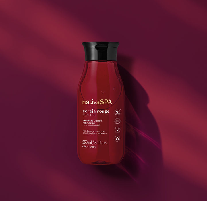 Boticário Nativa SPA Cereja Rouge Perfumed Body Wash 250 ml bottle styled on a cherry-red backdrop with soft shadows, Brazilian bath and body care – Buy now at MKPBR.COM – Worldwide Shipping