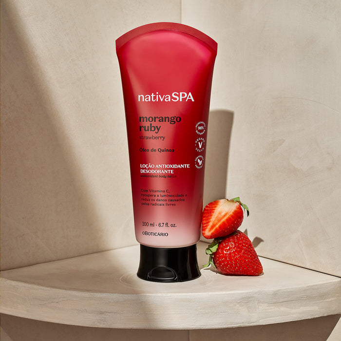 Nativa SPA Morango Ruby strawberry body lotion by O Boticário styled in a bright bathroom setting with fresh strawberries – Buy now at MKPBR.COM – Worldwide Shipping