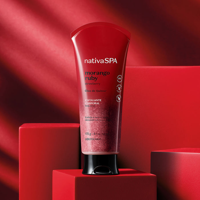O Boticário Nativa SPA Morango Ruby Body Scrub 6.17 oz tube standing on a red podium in a spa style studio set – Buy now at MKPBR.COM – Worldwide Shipping