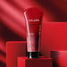 O Boticário Nativa SPA Morango Ruby Body Scrub 6.17 oz tube standing on a red podium in a spa style studio set – Buy now at MKPBR.COM – Worldwide Shipping