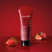 Nativa SPA Morango Ruby Body Scrub tube beside fresh strawberries highlighting the strawberry extract formula – Buy now at MKPBR.COM – Worldwide Shipping