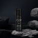Boticário Zaad Intense Deodorant Body Lotion 200 ml standing on dark wet rocks in a moody masculine lifestyle scene – Buy now at MKPBR.COM – Worldwide Shipping