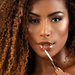Chocochilli Fran by Franciny Ehlke chocolate plumping gloss in model for full, hydrated lips – Buy now at MKPBR.COM – Worldwide Shipping