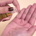 Clear lightweight texture of Forever Liss Banho de Verniz coconut oil drop – Buy now at MKPBR.COM – Worldwide Shipping