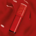 Close-up of Fran by Franciny Ehlke Glosslicious Cherry Lip Gloss, revealing its intense red color and glossy, luxurious texture – Buy now at MKPBR.COM – Worldwide Shipping