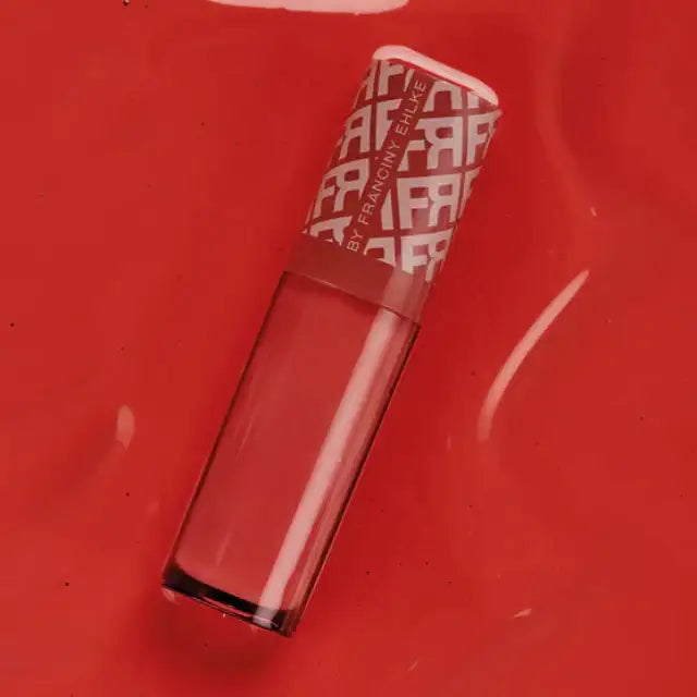 Detailed product shot of Fran by Franciny Ehlke Glosslicious Juicy Lip Gloss, emphasizing its smooth pink texture and vibrant color – Buy now at MKPBR.COM – Worldwide Shipping