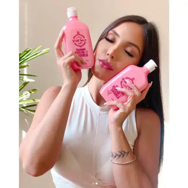 Beautiful woman with long dark hair gently holding Gold Spell Co. Sleep Effect Ultra-Hydrating & Anti-Volume Shampoo and Conditioner Set, conveying relaxation - Buy now at MKPBR.COM - Worldwide Shipping