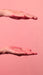 Rich pink cream texture of Gold Spell Everk Alisei Progressive Smoothing Treatment stretching between two hands – Buy now at MKPBR.COM – Worldwide Shipping