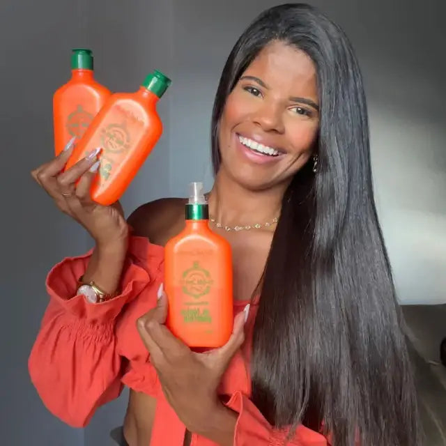 Smiling model with long straight hair holding Gold Spell Receitinha Poderosa 250ml tonic set - Buy now at MKPBR.COM - Worldwide Shipping