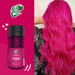 Lifestyle image of a woman with radiant magenta pink hair achieved with Kamaleão Color Pônei – Buy now at MKPBR.COM – Worldwide Shipping
