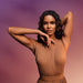Brazilian model in a tan pleated dress on a purple gradient backdrop for the O Boticário Liz D'Essence body cream campaign – Buy now at MKPBR.COM – Worldwide Shipping